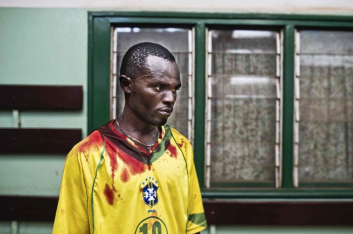 Central African Republic, Bangui, 24 January 2014 Romain Fiongaye came at the community hospital with his friend Fionboy, who has been shot in the head after clashes between Seleka soldiers and anti-balaka militiamen, in the district of Miskine. (c) Michael Zumstein